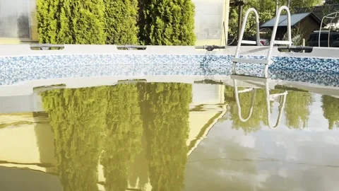 Reflection in the pool water of the faca... | Stock Video | Pond5