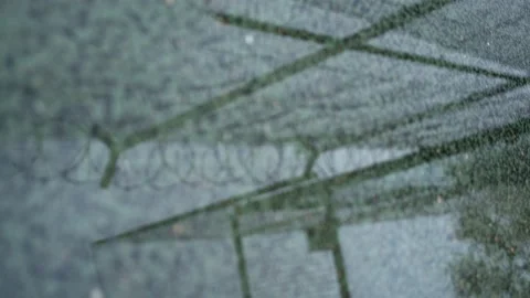 Reflection of a prison chain link fence with barbed wire Stock Footage 165052532
