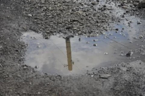 Reflection in a puddle. Stock Photos