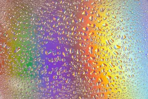 Reflection of the rainbow in the raindrops on the glass. Foto stock