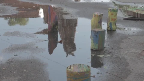 Reflection of Recycled Art Sculpture in a Puddle at KronFest Stock Footage 101606048