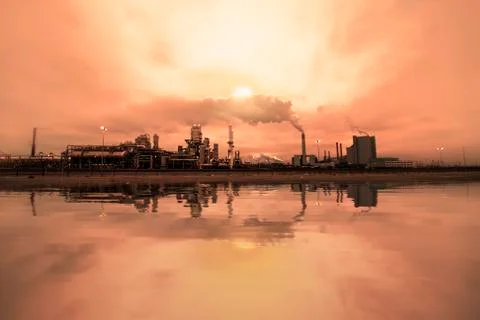 Reflection of refineries and its chimney  Stock-Fotos