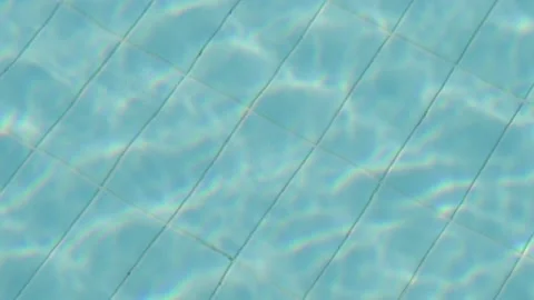 Reflection refraction in the water of the resort pool close-up Stock Footage 228503692