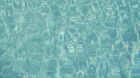 Reflection refraction in the water of the resort pool close-up Stock Footage 228504553