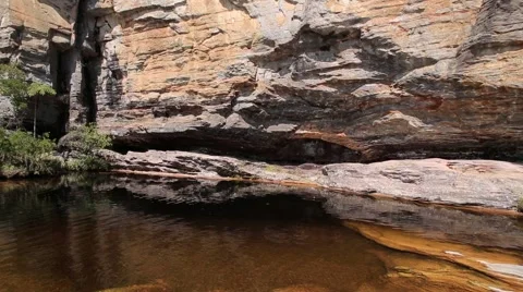 Reflection of rippled water on rock formation in Ibitipoca State Park Stock-Footage 51823834