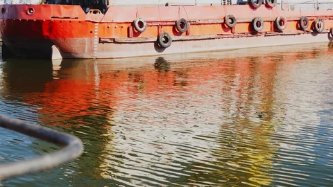 Reflection of ripples and waves on board of commerce ship. Sunlight water ref 스톡 동영상 114626045