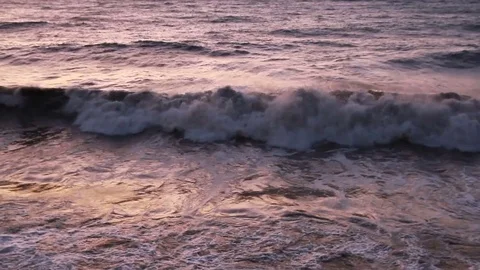 The reflection of the rising in the raging waves of the sea Stock Footage 85164104