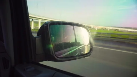 Reflection of the road in rearview mirror of a car Video stock 90178116