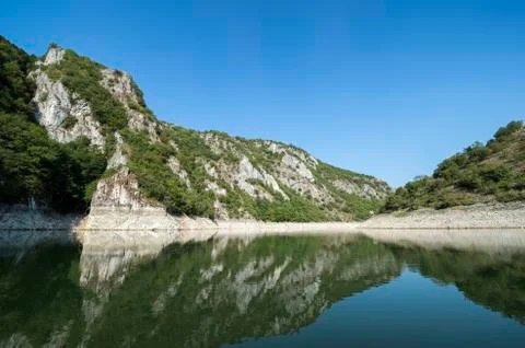 Reflection of rocks and trees Stock Photos