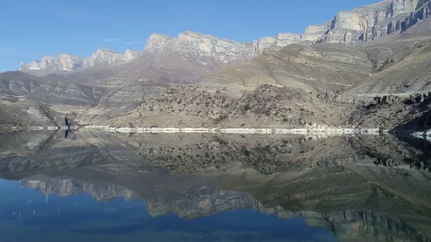 Reflection of rocks in a mountain lake Stock Footage 83726838