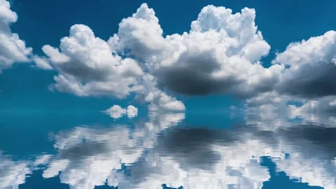Reflection of rolling white clouds in blue sky on water surface Stock Footage 260477379