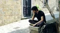 reflection of a sad pensive man sitting on a wall HD Footage