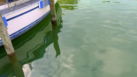 Reflection of a Sailing Boat on the Water Surface in a Sunny Summer Day Stock-Footage 247047721