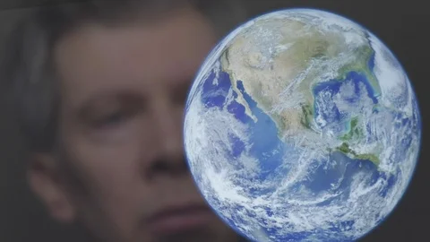 Reflection of a scientist looking at the earth Stock Footage 102589004