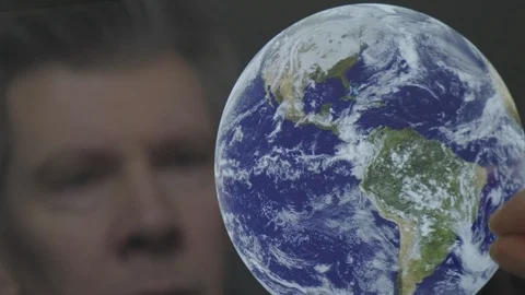 Reflection of a scientist looking at the earth Video stock 102589594