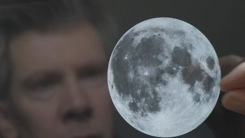 Reflection of a scientist looking at the moon Video stock 102587476