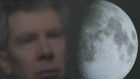 Reflection of a scientist looking at the moon Video stock 102588181