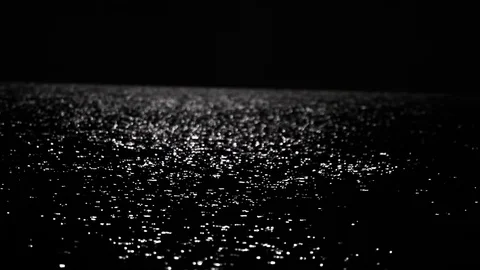 Reflection of sea light on water, moonlight glinting on water Stock Footage 100379291