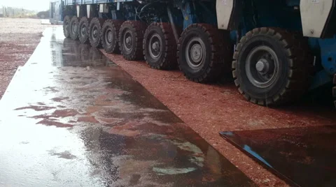 Reflection of Self Propelled Modular Transporter or SPMT on plate of steel Video stock 64166828