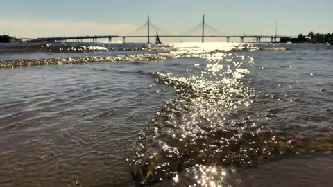 Reflection of the setting sun in the water.Sunset on the sea. Waves close-up. Na Stock Footage 145323540