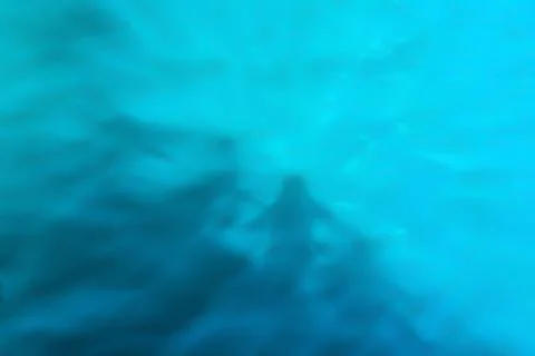 Reflection of shadows on blue water with waves, background Stock Photos