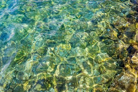 Reflection of shadows on blue water with waves, background Stock Photos