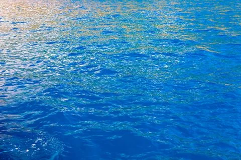 Reflection of shadows on blue water with waves, background Stock Photos