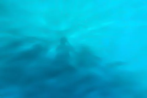 Reflection of shadows on blue water with waves, background Foto stock