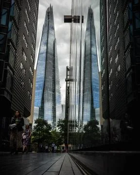 Reflection of the shard in the window of a shop form a low angle Stock Photos