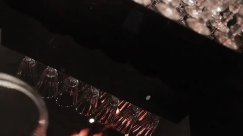 The reflection of the shot glasses on the table Stock Footage 308447585