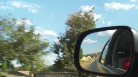 Reflection of Side Mirror of Car Driving Down Rural a Road Video stock 303844077