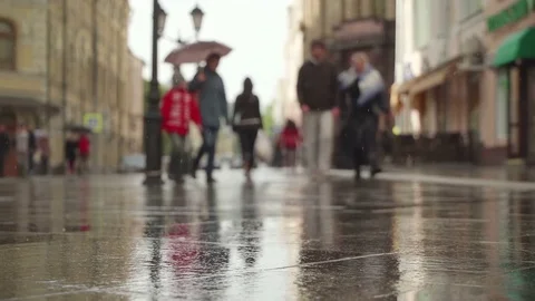 Reflection silhouettes people in pools wet asphalt in rain, Background of rainy Stock-Footage 84836104