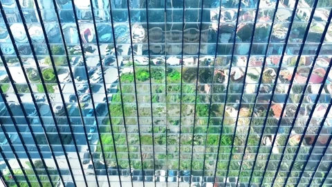 Reflection of the sky and buildings from the windows of the building Stock Footage 295782356