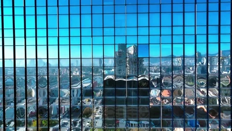 Reflection of the sky and buildings from the windows of the building Stock Footage 295782359