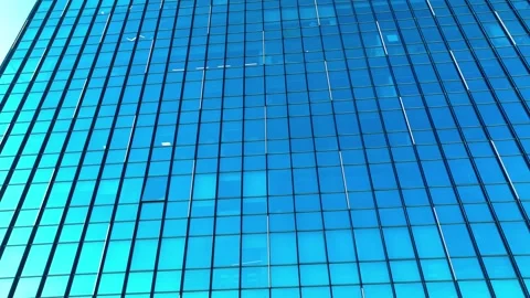 Reflection of the sky and buildings from the windows of the building Stock Footage 295782363