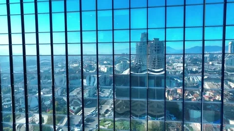 Reflection of the sky and buildings from the windows of the building Stock Footage 295782364