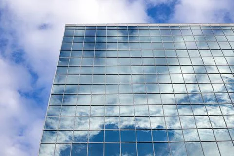 Reflection of sky with clouds in the glass building in downtown Stock Photos