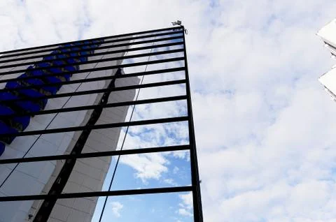 The reflection of the sky mirrored building Stock Photos
