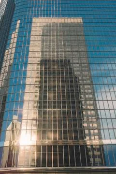Reflection of Sky Scraper Building on an all Glass Building Stock Photos