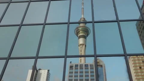 A reflection of the Sky tower in building windows, Auckland, New Zealand Vídeos de archivo 238578613