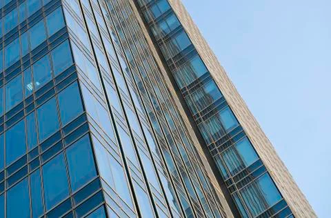 Reflection of the sky in the windows of a building. Perspective and underdite Fotos de archivo