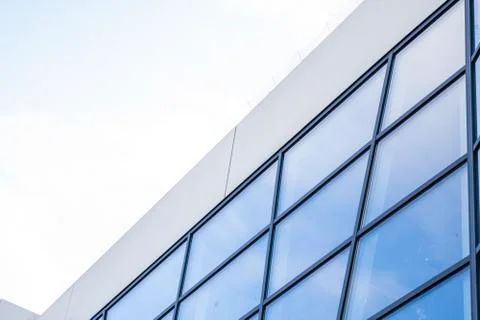 Reflection of the sky in the windows of a building. Perspective and underdite Stock Photos