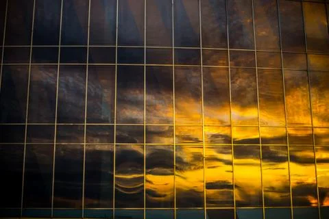 Reflection of the sky in the windows in a sbuilding Photos