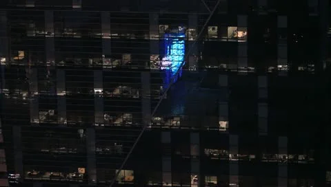 Reflection on skyscraper window at night Stock Footage 11350304