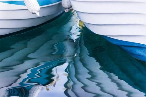 Reflection of small boats on the surface of the sea. Abstract background Foto stock