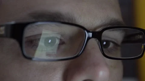 Reflection of smartphone on mans eyeglasses. 4K UHD. Stock Footage 49580817