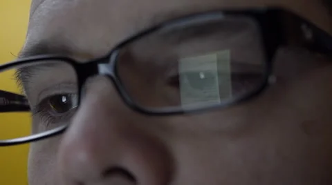 Reflection of smartphone on mans eyeglasses. 4K UHD. Stock Footage 49581750