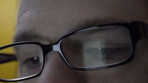 Reflection of smartphone on mans eyeglasses. 4K UHD. Stock-Footage 49582043