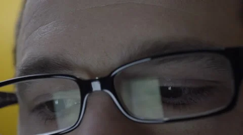 Reflection of smartphone on mans eyeglasses. 4K UHD. Stock Footage 49582388