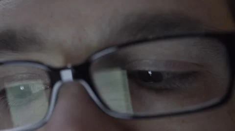 Reflection of smartphone on mans eyeglasses. 4K UHD. Stock Footage 49582920